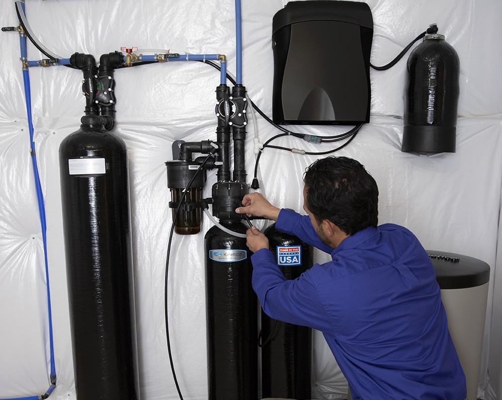 Technician working on water softener system
