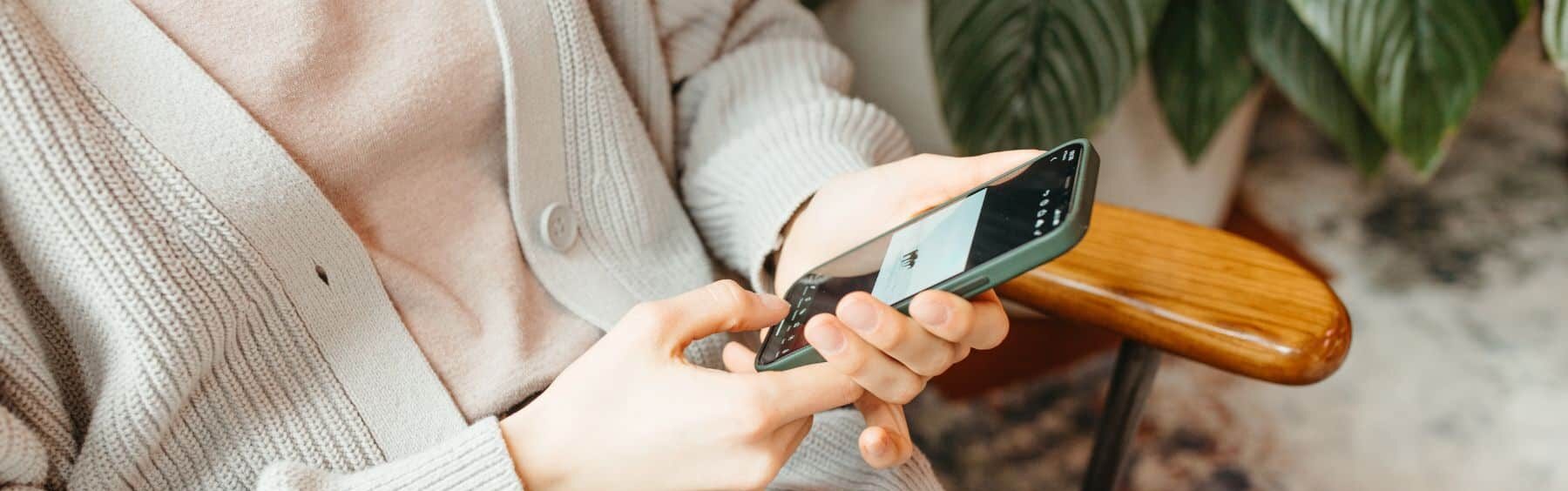 woman on her phone looking at social media